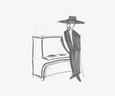 guy in a fancy hat near the piano