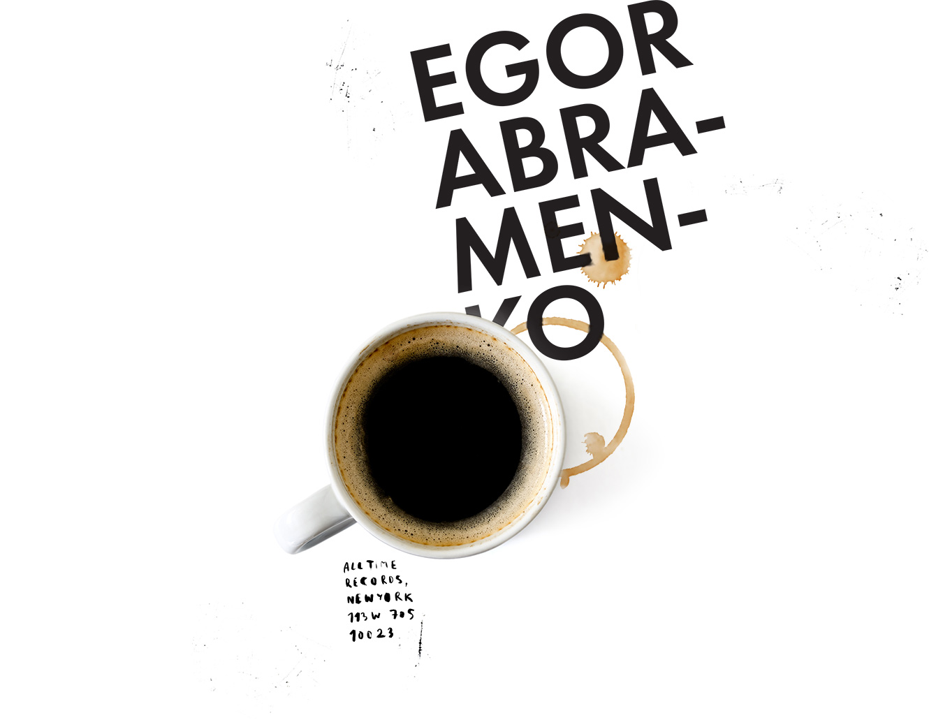 coffee cup with egor abramenko logo nearby